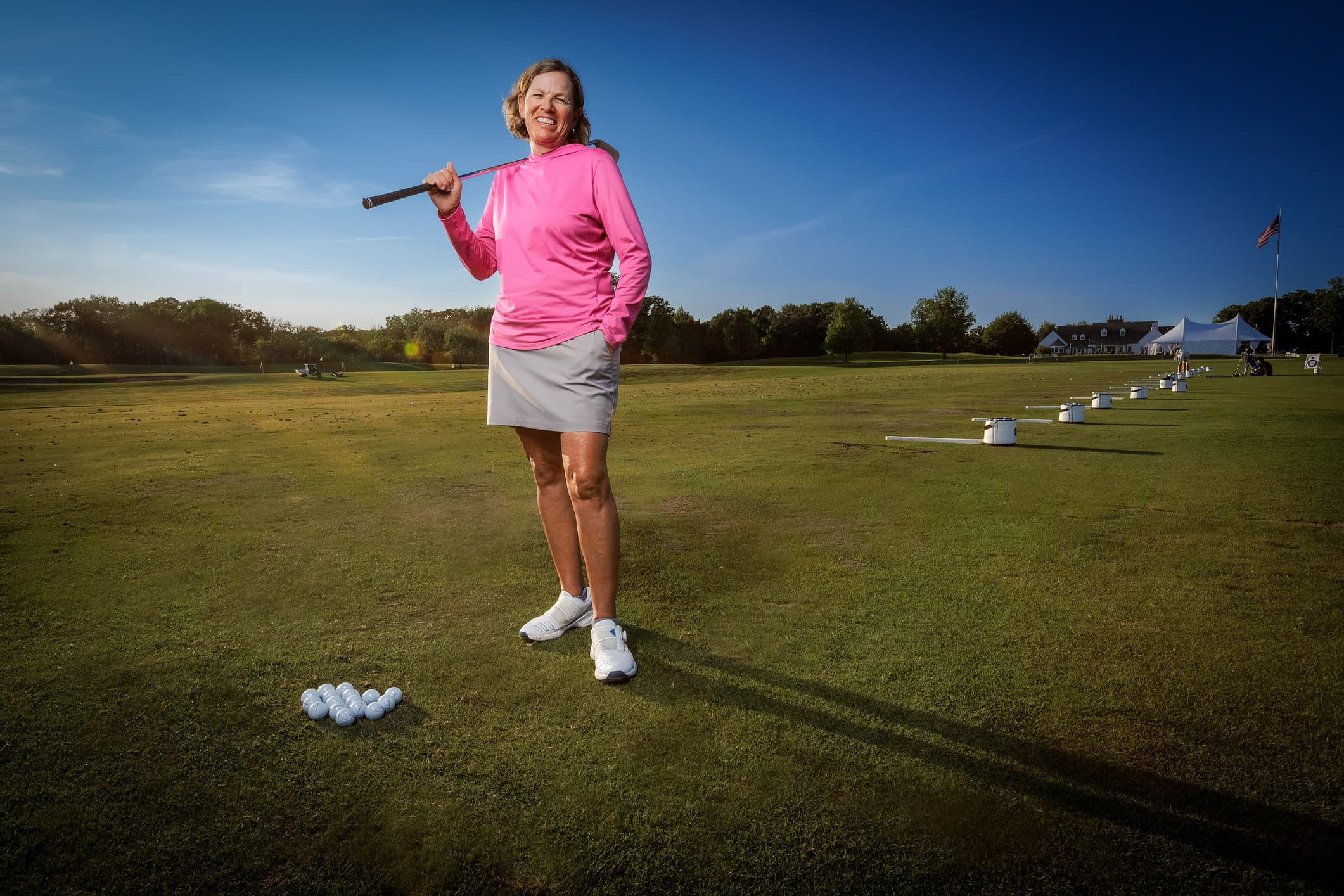 Jamie Fischer posing on the driving range